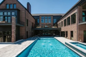 Luxury house with pool and brick exterior.